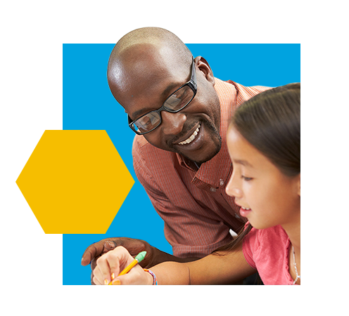 Male teacher helping young female student